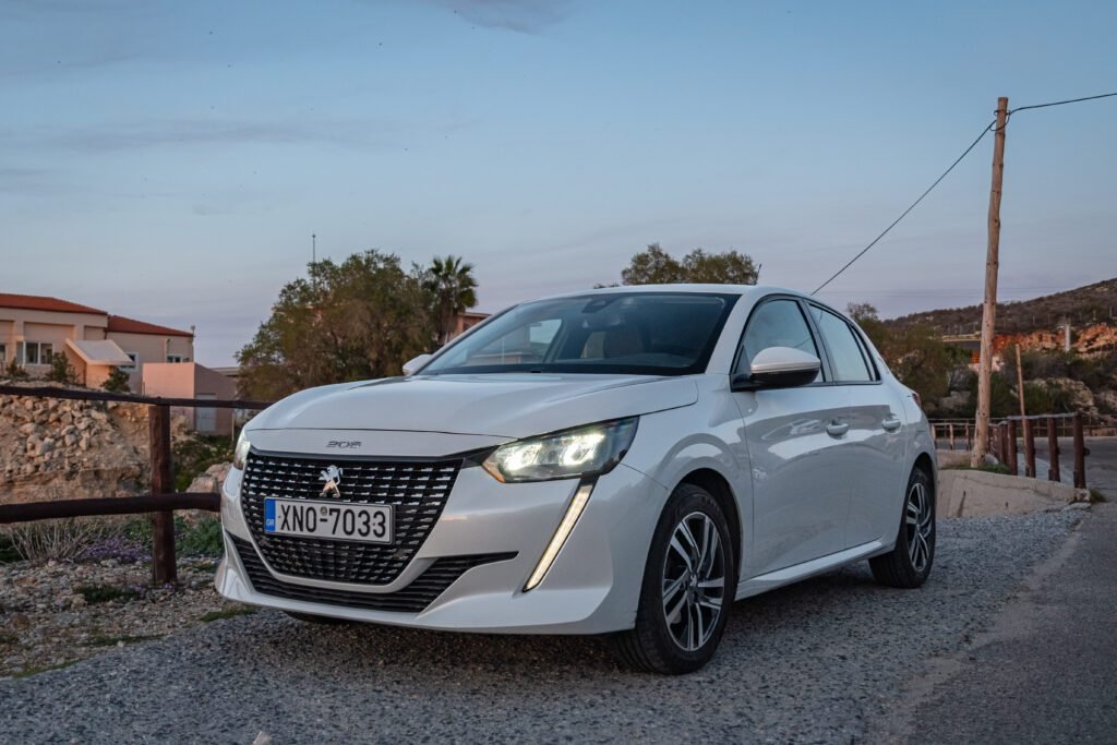 White Peugeot 208 front view Chania