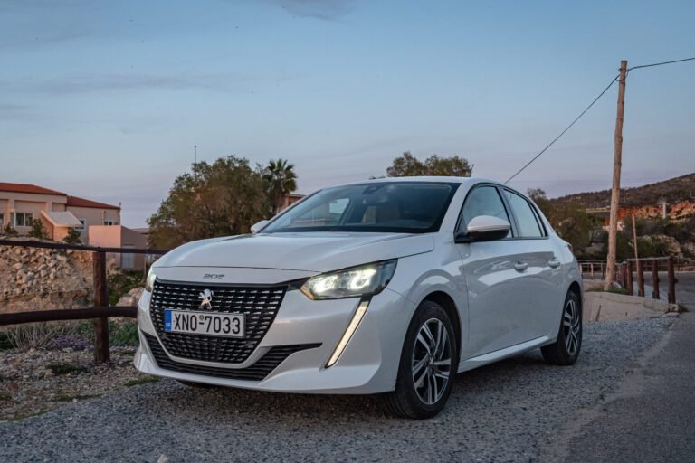 White Peugeot 208 front view Chania
